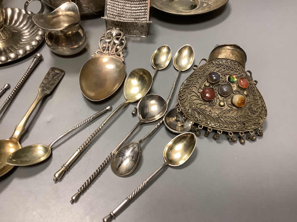 A late 19th century Russian gilt 84 zolotnik tea cup and saucer, dated 1883, a pair of similar salts and a group of other items.